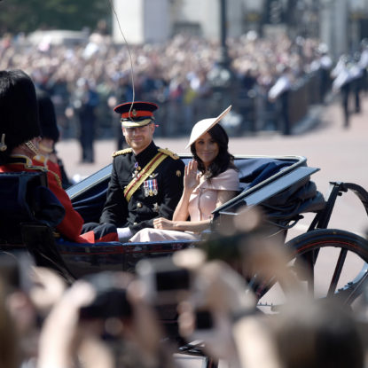 The Duke and Duchess of Sussex ride in a carriage at the annual Queen’s Birthday Parade
